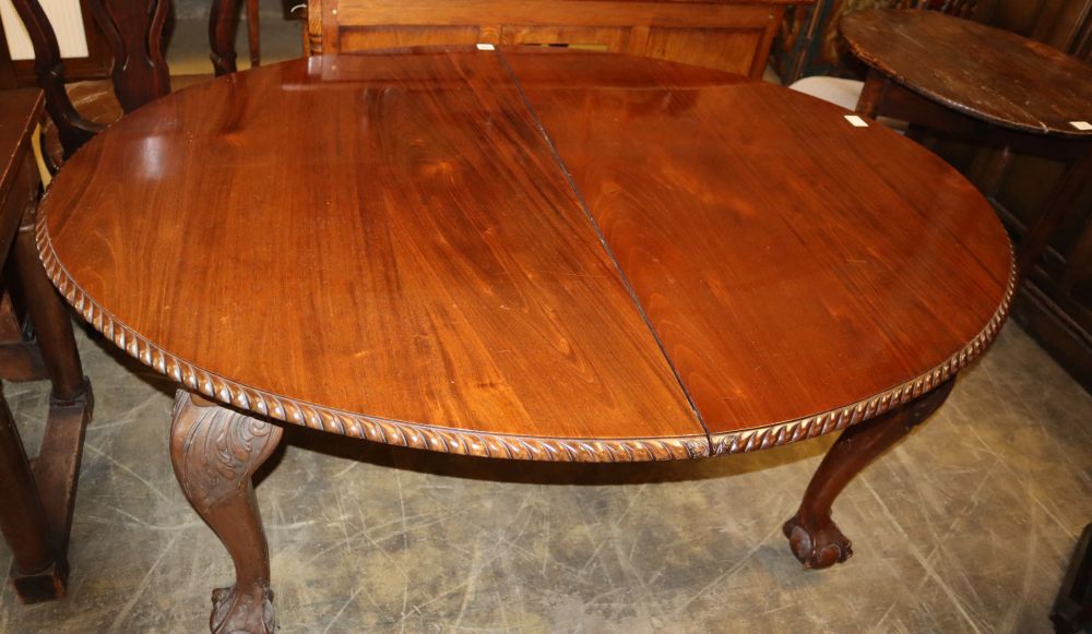 A 1920s Chippendale revival mahogany extending dining table, 210cm extended (two leaves and winder)